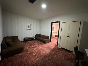 a living room with two couches and a couch at Hotel Cash in Tbilisi City +34 photos