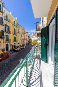 a view of a street from a balcony of a building at Isabel Luxury Suite in Ischia +1 photo