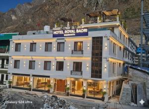 a hotel in front of a mountain at Hotel Royal Badri - A Pilgrim's Habitat in Badrinath