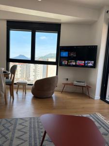 a living room with a large view of a city at Mare e Monti in Bar