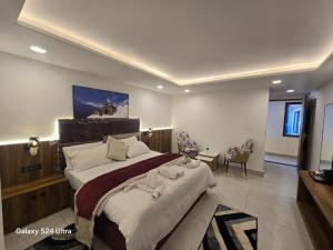 a bedroom with a large bed in a room at Hotel Royal Badri - A Pilgrim's Habitat in Badrinath
