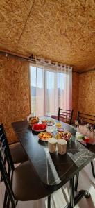 a black table with food on top of it at Yurt camp Visit Kol-Suu in Kol-Suu +83 photos