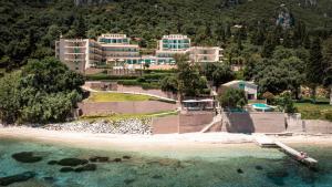 an aerial view of a resort on a beach at Canvas by Mitsis Belvedere in Benitses