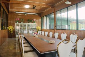 a large conference room with a long table and chairs at MIK Resort & Hotel in Pasuruan +72 photos