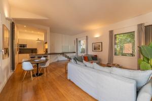 a living room with a couch and a table at LOFT sull'acqua con vista mozzafiato in Naples