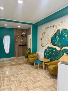 a waiting room with a large painting on the wall at Da Delfina Affittacamere in Anzio