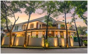 a house with trees in front of it at Treehouse Suites at Kuningan - Boutique Serviced Apartment in Jakarta