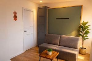 a living room with a couch and a table at Winahost Madrid Towers II in Madrid