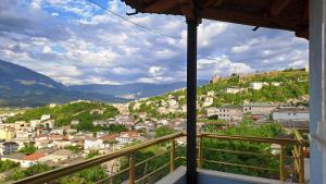 a view of a city from a balcony at Amari Rooms in Gjirokastër