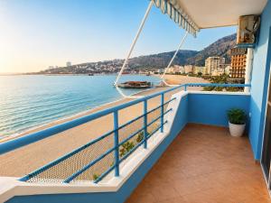 a balcony on a cruise ship with a view of the water at Sea view apartment 1 in Shëngjin