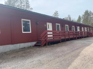 a large red building with a row of windows at Hendriks Matz-Roan in Åmot