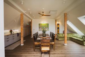 a living room with a table and a couch at Mia Hotel in Orissaare