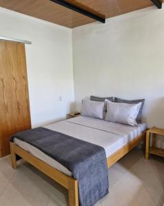 a bedroom with a bed in a room at Loft da Árvore in Petrópolis +5 photos