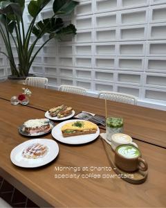 a wooden table with plates of food on it at Chez Abel in Las Palmas de Gran Canaria +49 photos