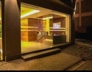a store front with a large glass window on a building at Tsavo Stanley in Kiambu