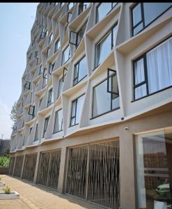 a tall building with a lot of windows at Tsavo Stanley in Kiambu