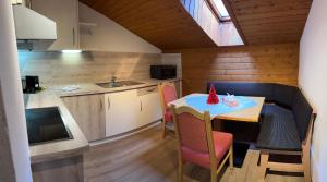 a kitchen and dining room with a table and chairs at Haus Raimund in Längenfeld +30 photos