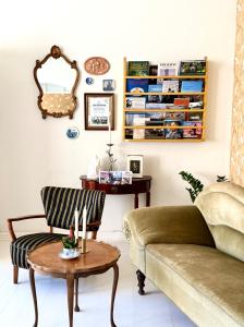 a living room with a couch and a table at Hotel Faaborg in Faaborg
