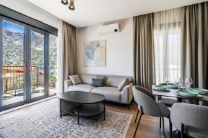 a living room with a couch and a table at Risan Bay in Risan