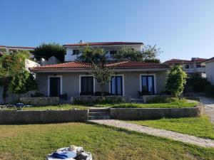 a house in the middle of a yard at Diomare Villas in Kypseli