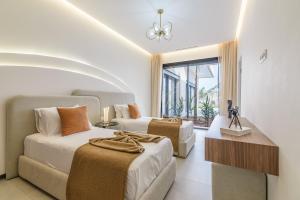 a hotel room with two beds and a window at Villa Milabel in Segraga +44 photos