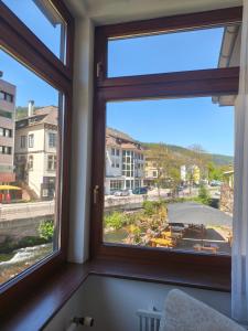 a window in a room with a view of a building at Vinami Hotel - Bad Wildbad in Bad Wildbad +20 photos