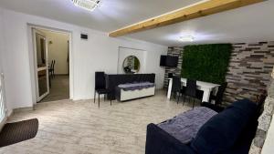a living room with a couch and a table at Casa Ducaru Moieciu de Sus in Moieciu de Sus