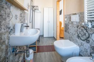 a bathroom with a sink and a toilet at Casa Immacolata in Polignano a Mare