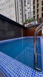 a swimming pool on top of a building at Orient Lux in Yakkasaray