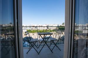 a view of a balcony with a table and chairs at Casa Immacolata in Polignano a Mare