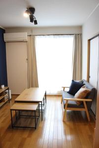 a living room with a couch and a table at 2026APR NEW Open! SETOUCHI BLUE BASE in Utazu