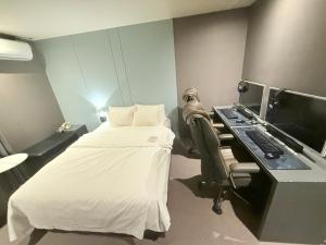 Llit o llits en una habitació de Flex 9 Hotel
