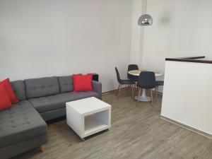 a living room with a couch and a table at Ferienwohnung Friederike Luise in Bad Freienwalde +1 photo
