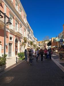 a group of people walking down a street at Antica Dimora Petito Luxury Suites in Matera +67 photos