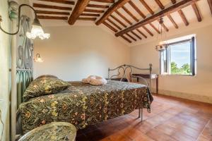 a bedroom with a bed and a window at Il Casale di Zoe in Sorano +35 photos