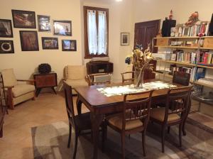 a dining room with a table and chairs at Dulcius ex Asperis Bed & breakfast in Ponte Nizza