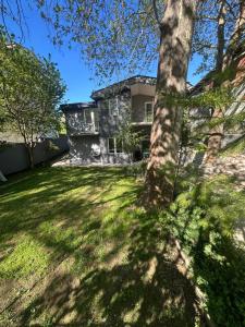 a house with a tree in front of it at Casa Matthias in Kavadarci