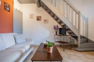 a living room with a couch and a table at Le Bouquet de l Aromate in Joucas