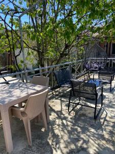 a group of chairs and tables on a patio at Andre in Kutaisi +14 photos