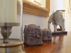 a room with a statue of an elephant and a mirror at Causey Pike in Keswick +5 photos