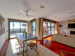 a living room with a table and a couch at Vivalidays Villa Amatista in Caldes d'Estrac
