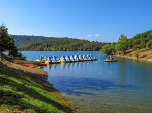 a group of people in boats on a lake at Studio in Fayence