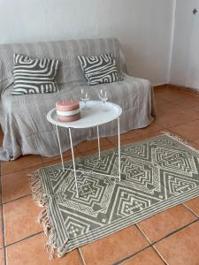 a living room with a couch and a table at Studio in Fayence