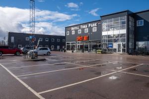 a parking lot in front of a building at Hotell TunaPark in Eskilstuna