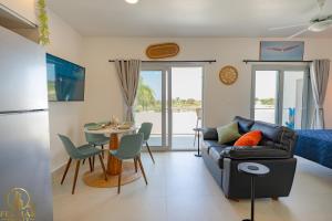 a living room with a couch and a table at Ideal accommodation for couples Sosúa, Santa Fe in Sosúa
