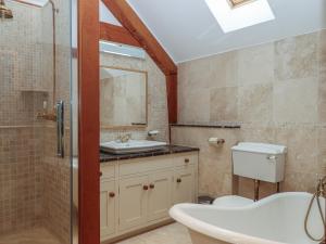 a bathroom with a sink and a toilet and a shower at Pylemoor Cottage in Tiverton +49 photos