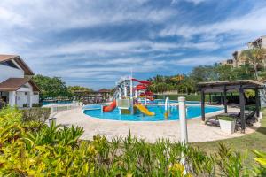 a playground at a resort with a water slide at Ideal accommodation for couples Sosúa, Santa Fe in Sosúa