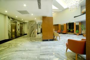 an office lobby with a marble floor and a large lobby at Downtown Sirkeci Hotel in Istanbul