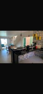 a kitchen with a sink and a counter top at Casa de Praia do Abais in Estância +7 photos