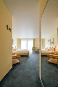 Giường trong phòng chung tại Hotel Lessing